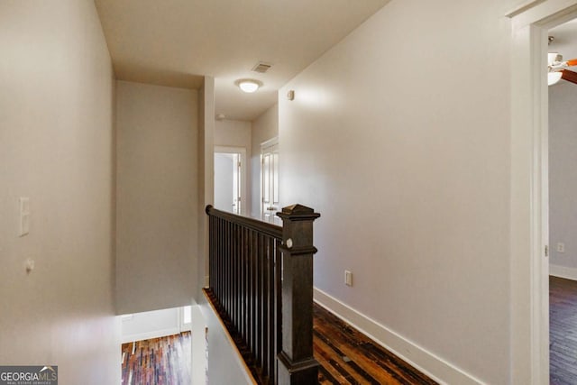 hall with dark hardwood / wood-style floors