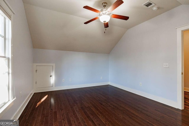 bonus room with ceiling fan, dark hardwood / wood-style flooring, and lofted ceiling