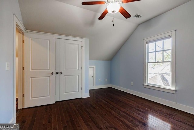 bonus room featuring vaulted ceiling, ceiling fan, and dark wood-type flooring