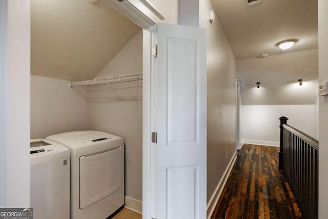 laundry area featuring independent washer and dryer and dark hardwood / wood-style floors