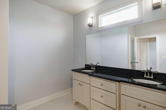 bathroom with vanity and tile patterned flooring