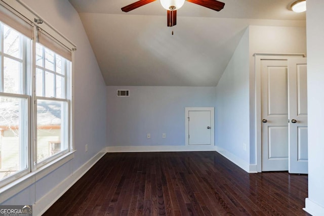 additional living space with ceiling fan, dark hardwood / wood-style flooring, and lofted ceiling