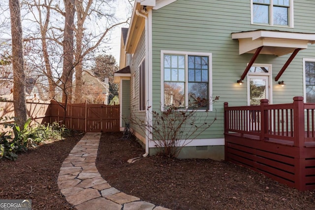 view of side of property with a deck