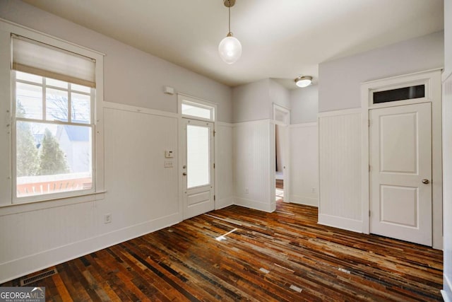 foyer entrance featuring dark hardwood / wood-style floors