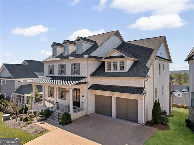 view of front of house featuring a garage, a front yard, cooling unit, and a porch