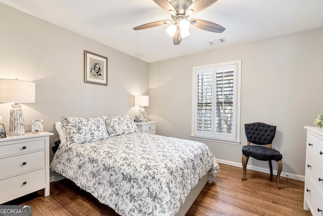 bedroom with ceiling fan and hardwood / wood-style floors