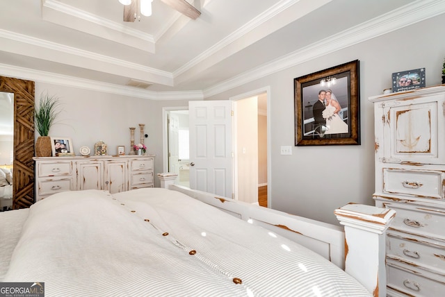 bedroom with ornamental molding and a raised ceiling