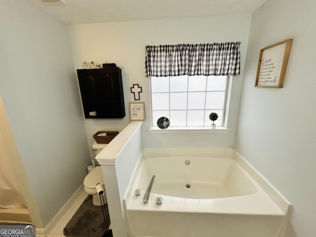 bathroom featuring toilet and a bath