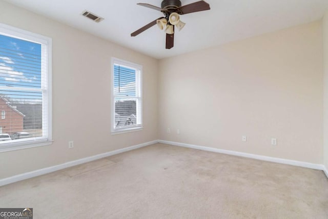 carpeted empty room with ceiling fan