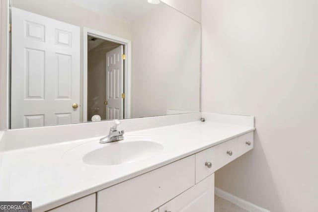 bathroom with vanity and tile patterned floors