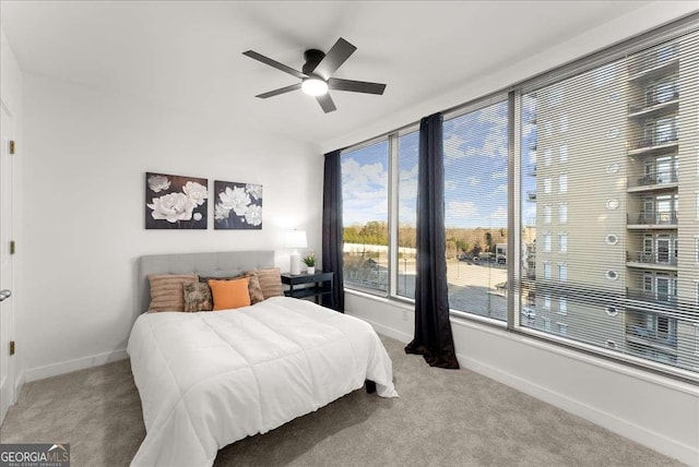 bedroom with ceiling fan and carpet floors