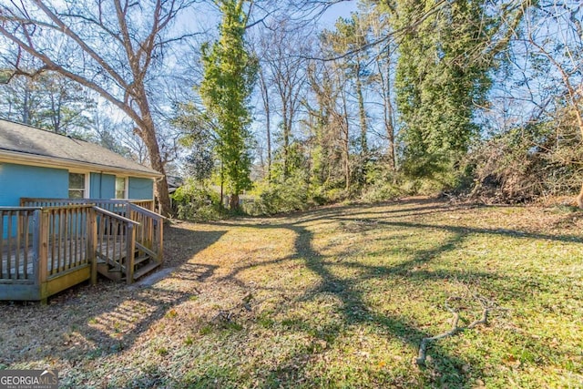 view of yard featuring a wooden deck