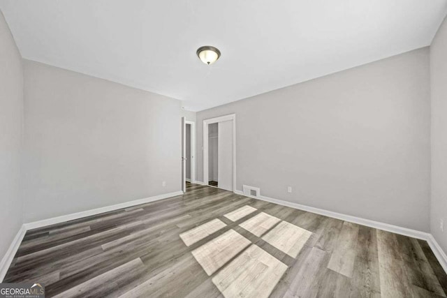spare room featuring hardwood / wood-style floors