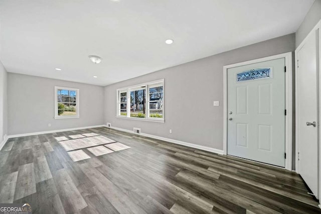 foyer entrance with dark hardwood / wood-style flooring