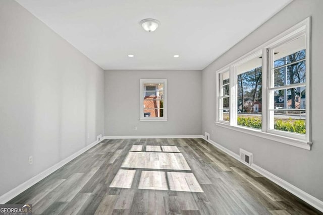 empty room with wood-type flooring