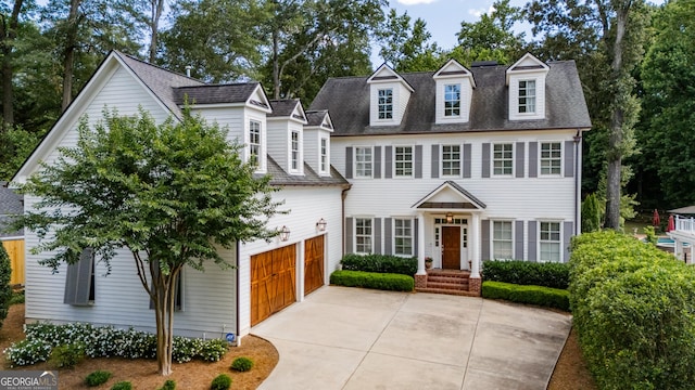 colonial inspired home featuring a garage