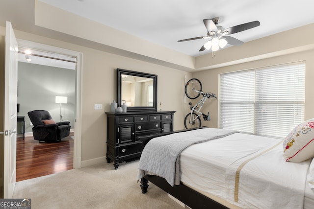 carpeted bedroom with ceiling fan