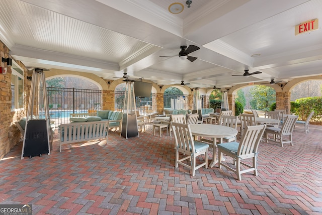 view of patio featuring a community pool, an outdoor hangout area, and ceiling fan