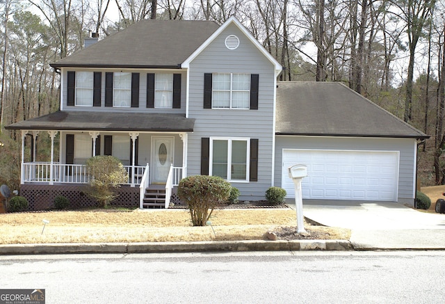 view of front facade with a garage and covered porch