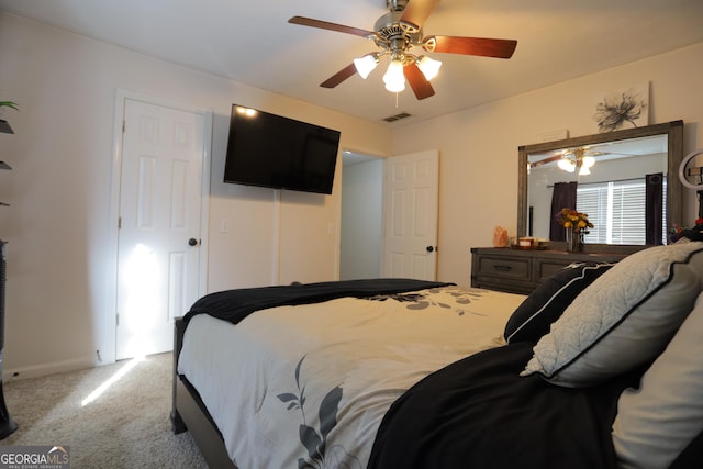 bedroom with light carpet and ceiling fan