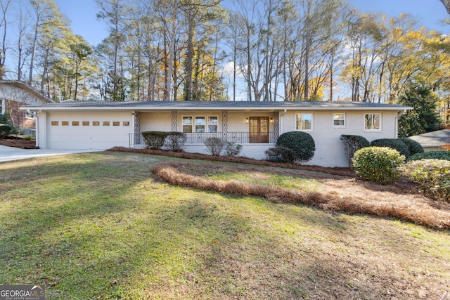 ranch-style house featuring a garage and a front yard