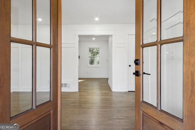 hallway with dark wood-type flooring