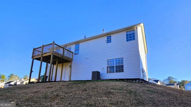 back of property with cooling unit and a deck