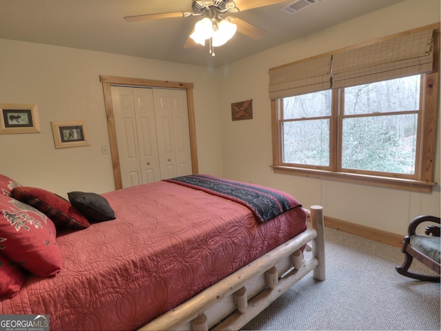 bedroom featuring carpet flooring, a closet, and ceiling fan