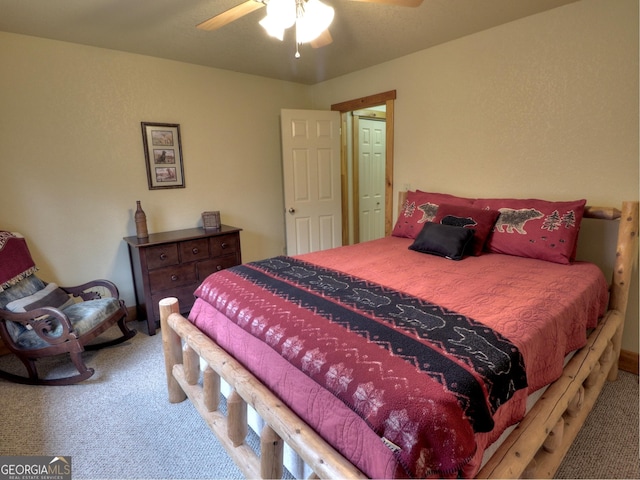 bedroom featuring ceiling fan and carpet