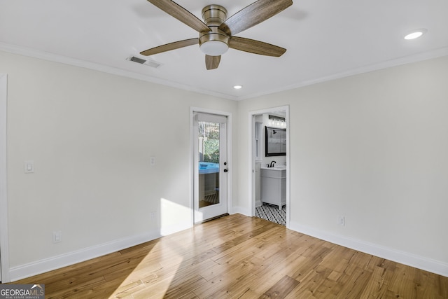 unfurnished bedroom featuring access to exterior, light hardwood / wood-style flooring, and ornamental molding