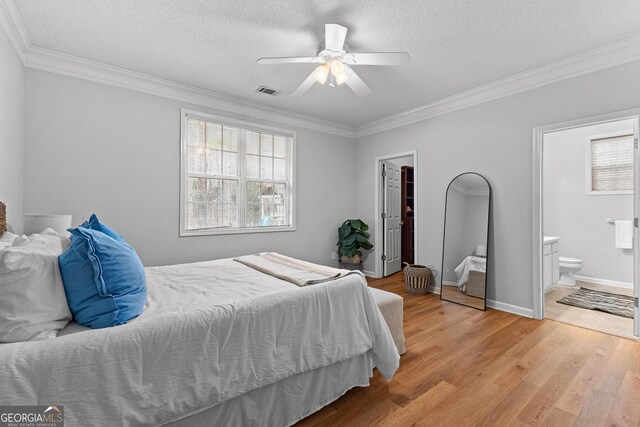 walk in closet featuring light hardwood / wood-style floors