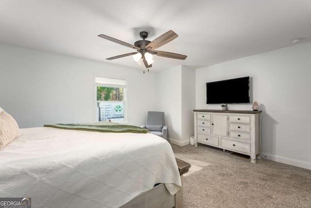 bedroom with ceiling fan and light carpet