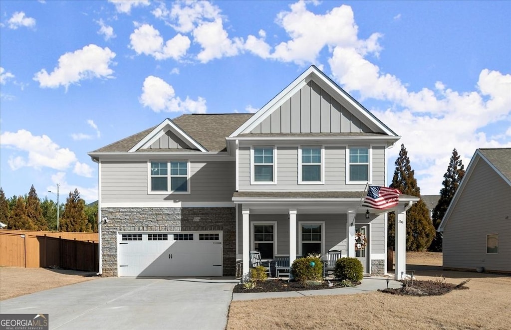 view of front of house featuring a garage and a porch