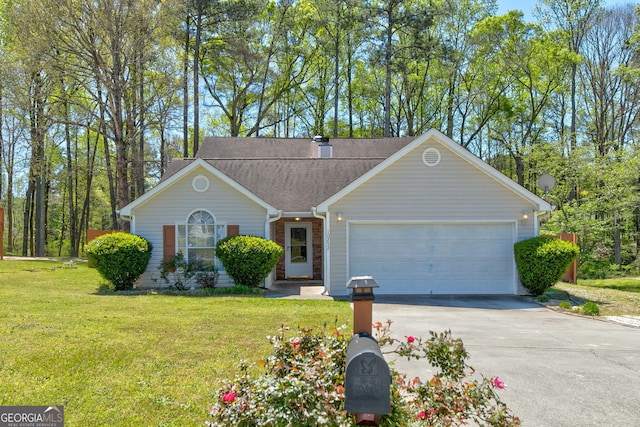 single story home featuring a garage and a front yard