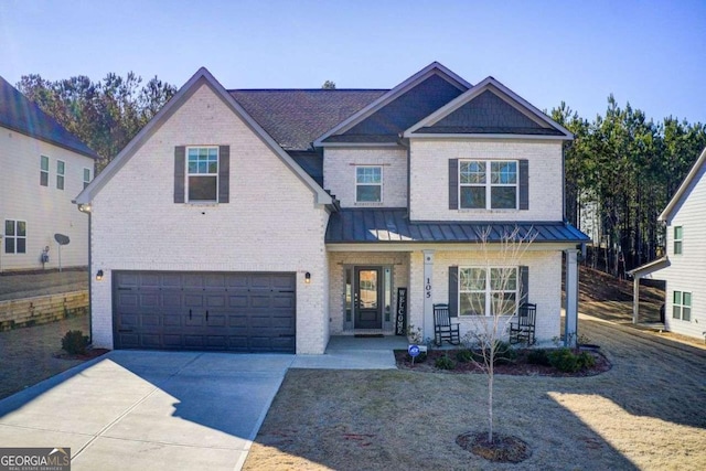 view of front of home with a garage and covered porch