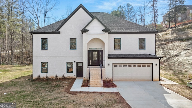 view of front of property with a garage and a front yard