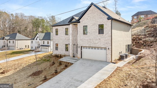 view of front of house featuring a garage and cooling unit