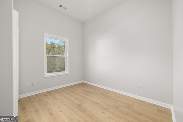 unfurnished room featuring light hardwood / wood-style floors