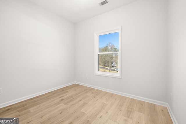 unfurnished room featuring light hardwood / wood-style floors