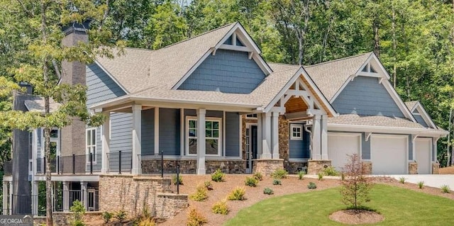 craftsman-style house with a front yard