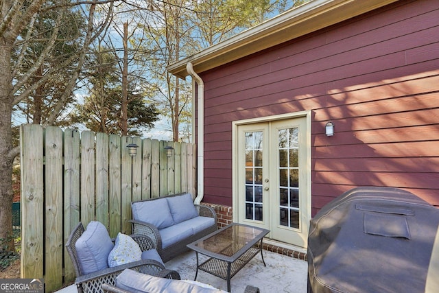 exterior space with french doors, a patio area, an outdoor hangout area, and area for grilling