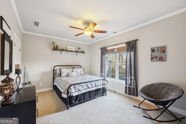 carpeted bedroom featuring crown molding and ceiling fan