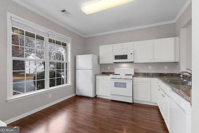 kitchen with white appliances, a sink, visible vents, white cabinetry, and dark countertops