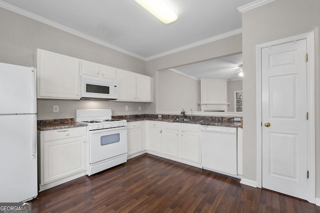 kitchen featuring white appliances, dark wood finished floors, white cabinets, dark countertops, and a sink