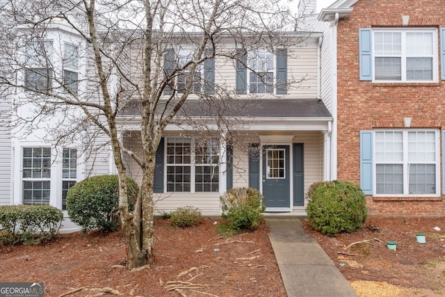 view of front of house with brick siding