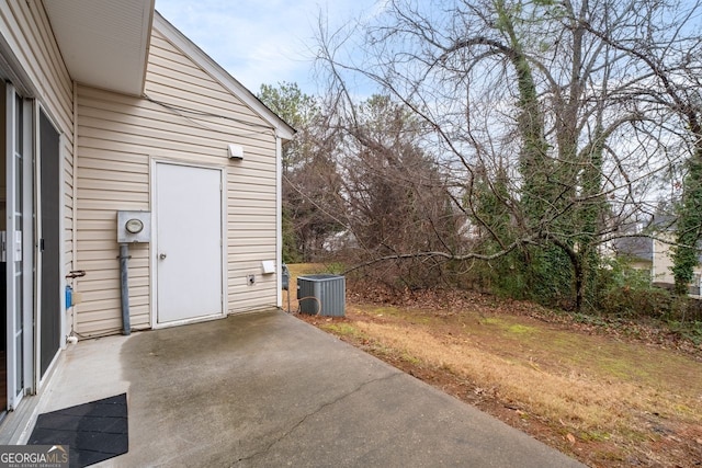 exterior space with a patio area and central AC