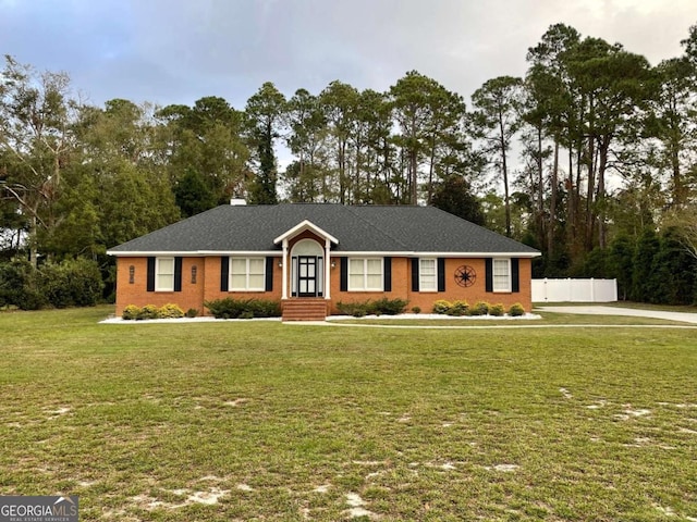 ranch-style house featuring a front lawn