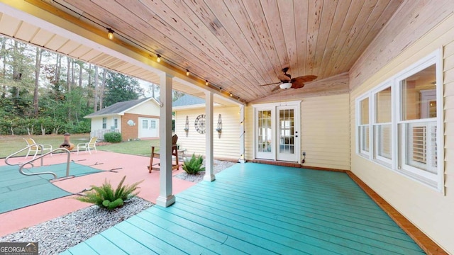 wooden terrace with an outbuilding