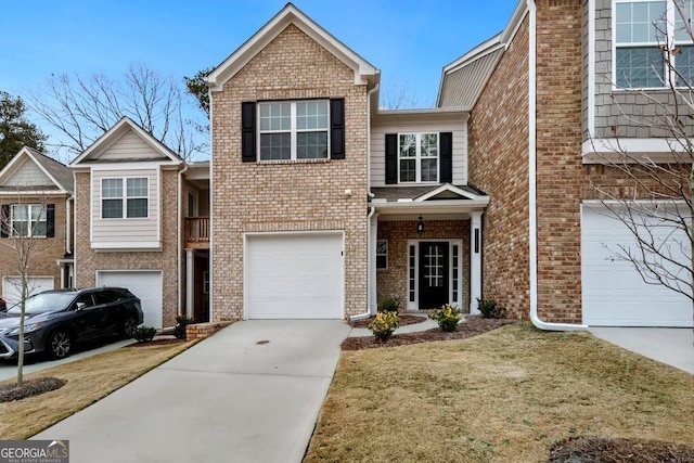 view of front of home featuring a front yard and a garage