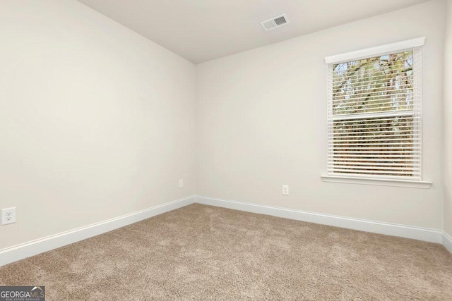 empty room featuring carpet flooring